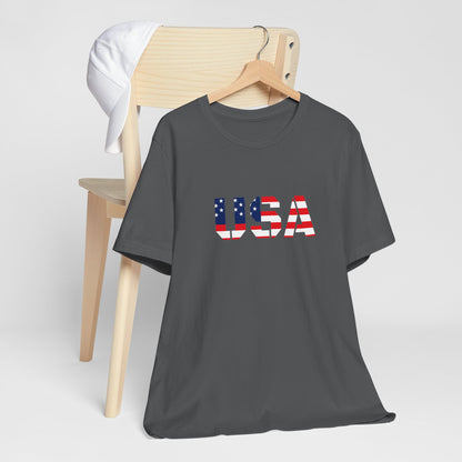 USA flag text T-shirt by Printify featuring patriotic Fourth of July design, denim background, and casual fit.