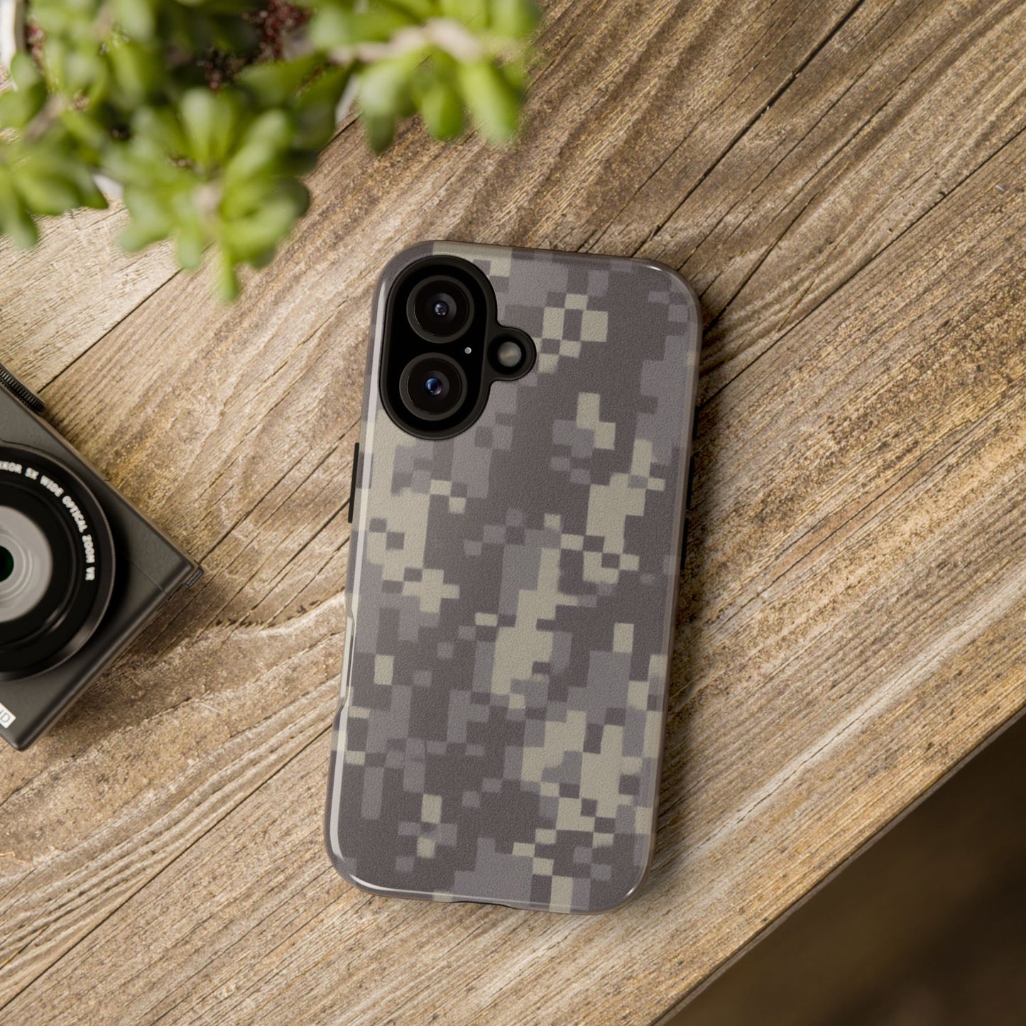 Rugged digital camo Printify tough phone case protecting a smartphone with a durable camouflage design.