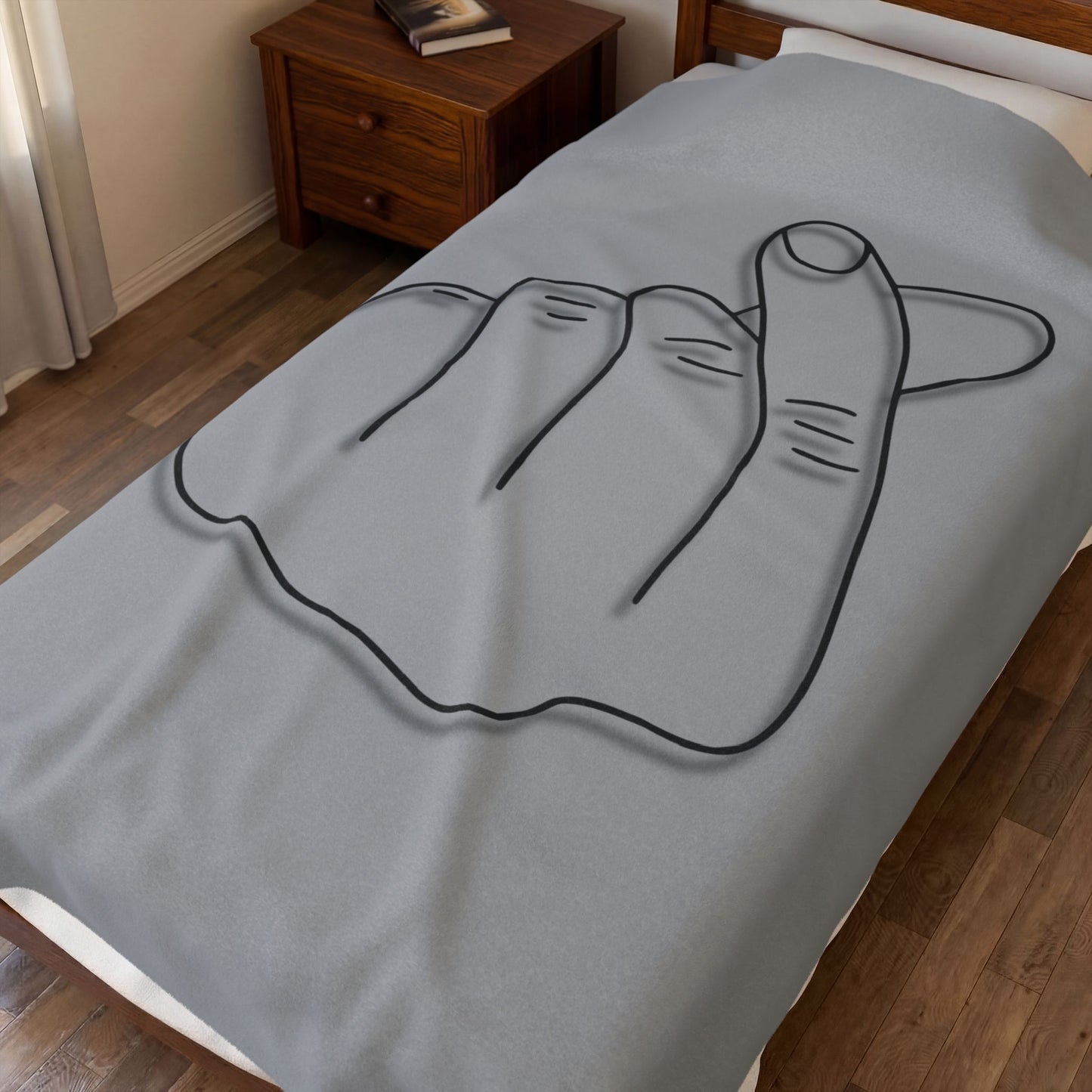 Velveteen plush blanket featuring an all-over heart gesture print, ideal for cozy home decor and gift-giving.