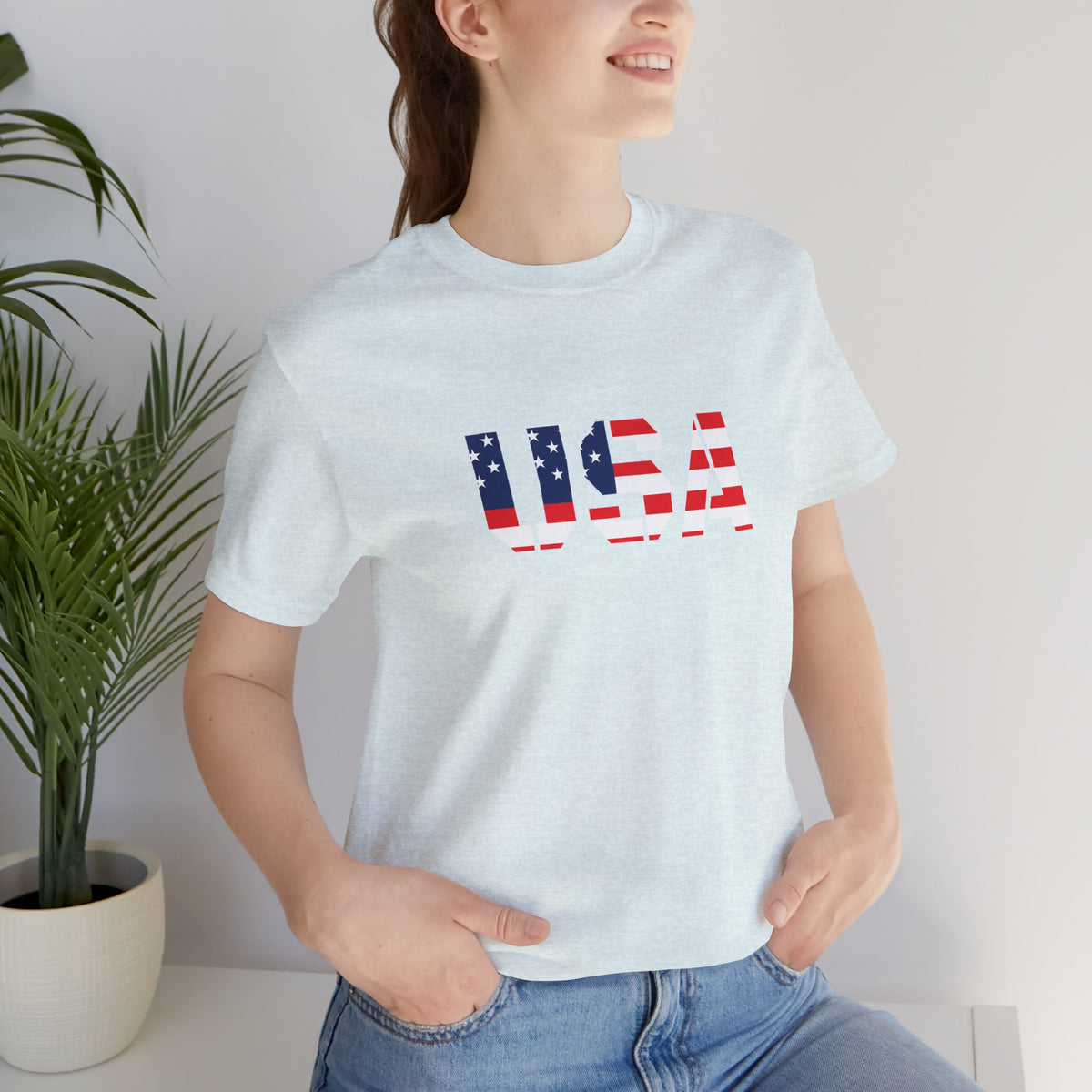 USA flag text T-shirt by Printify featuring patriotic red, white, and blue design for Fourth of July celebrations.