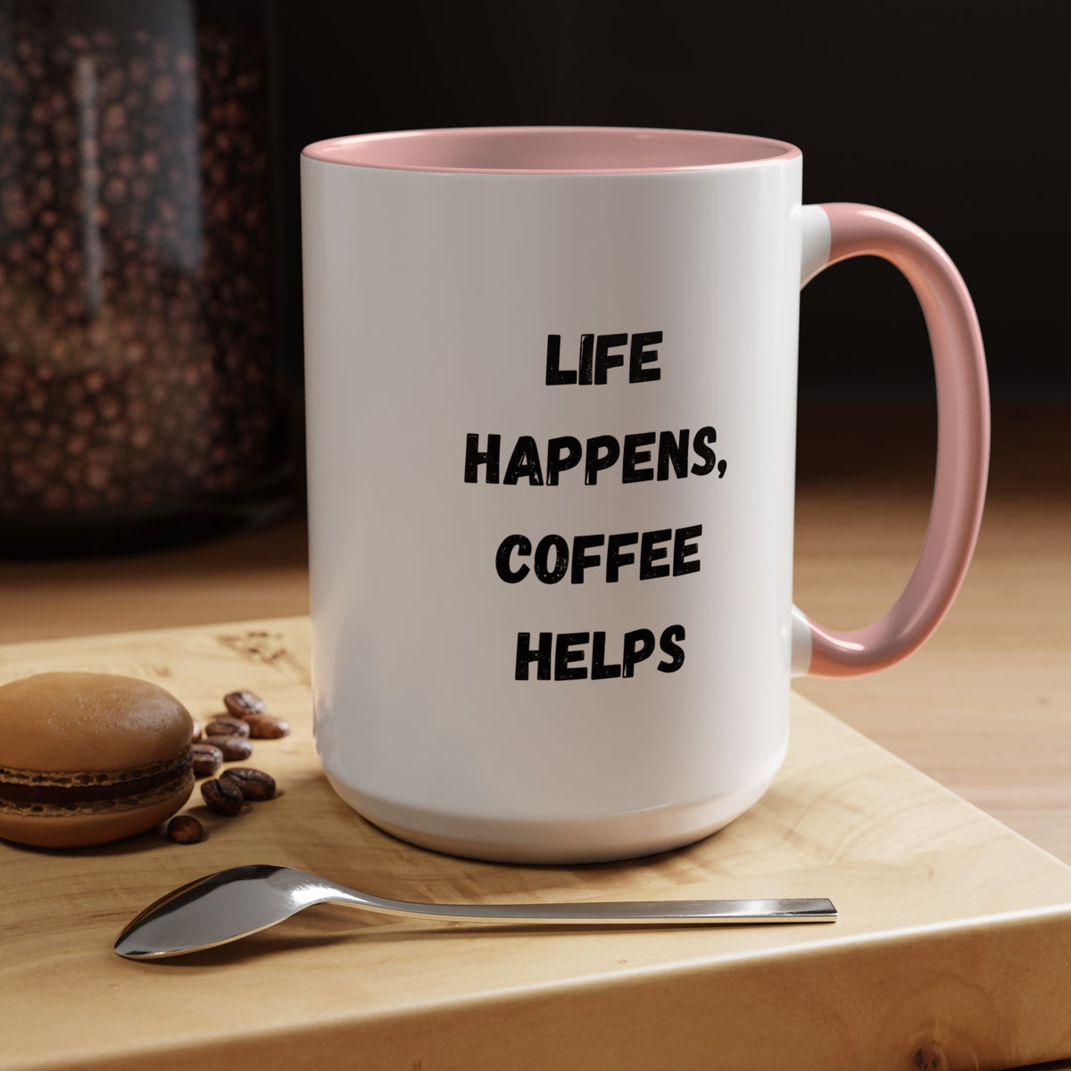 Black ceramic mug with "Life Happens Coffee Helps" phrase, 11oz or 15oz size, featuring a black handle and rim.