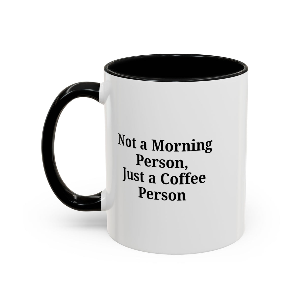 Ceramic coffee mug with "Not a Morning Person, Just a Coffee Person" print, featuring a white handle and colorful design.
