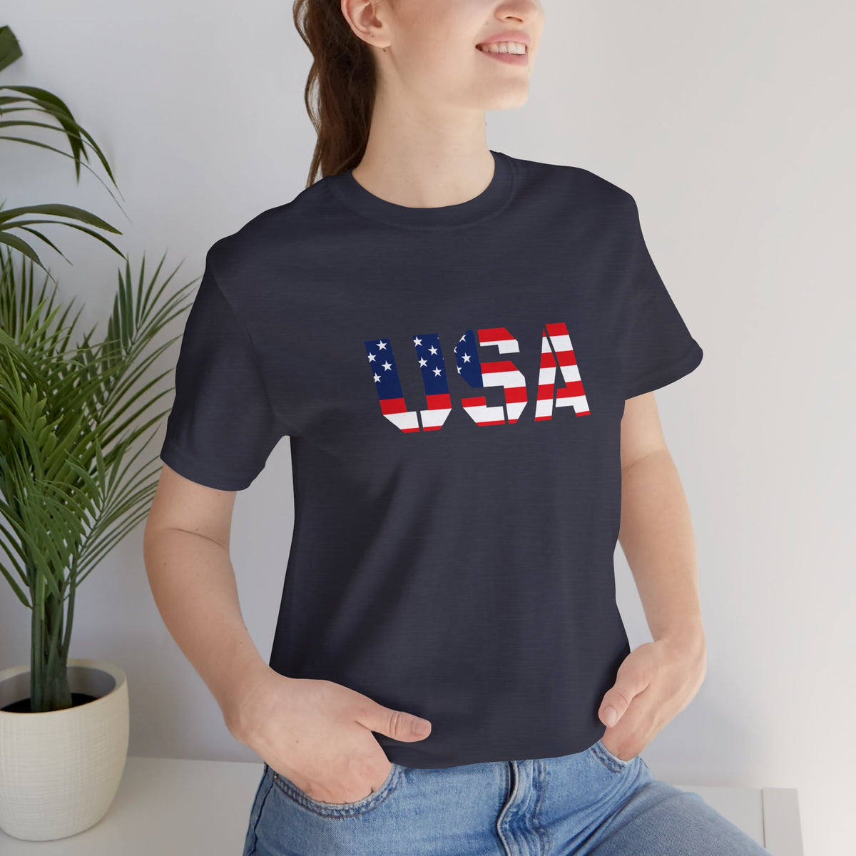 USA flag text T-shirt by Printify featuring patriotic Fourth of July design on a casual cotton tee.