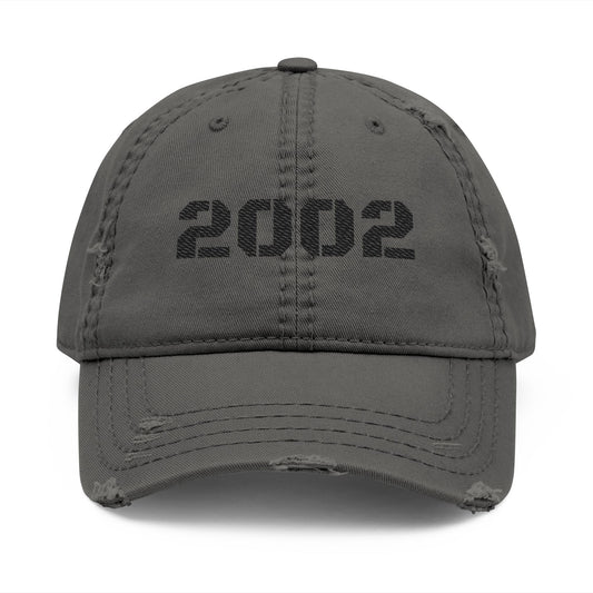 Vintage distressed 2002 dad hat with embroidered design, casual baseball cap by Printify with worn, stylish look.