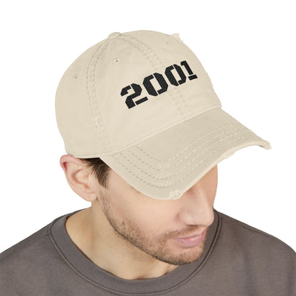Vintage washed distressed embroidered dad hat with '2001' in black lettering, featuring a classic baseball cap style by Printify.