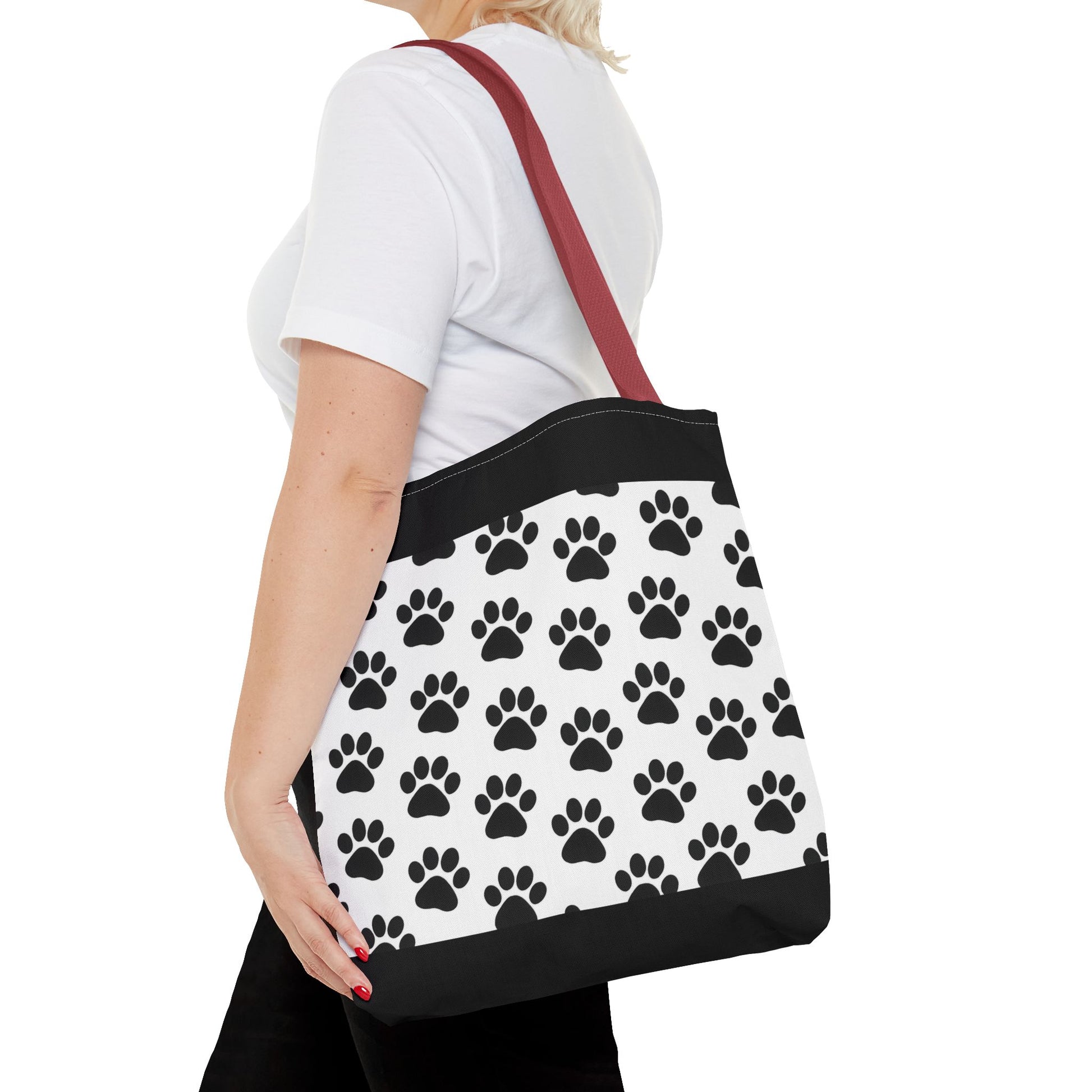Eco-friendly paw print tote bag by Printify featuring dog and cat paw designs, perfect for animal lovers to carry essentials.