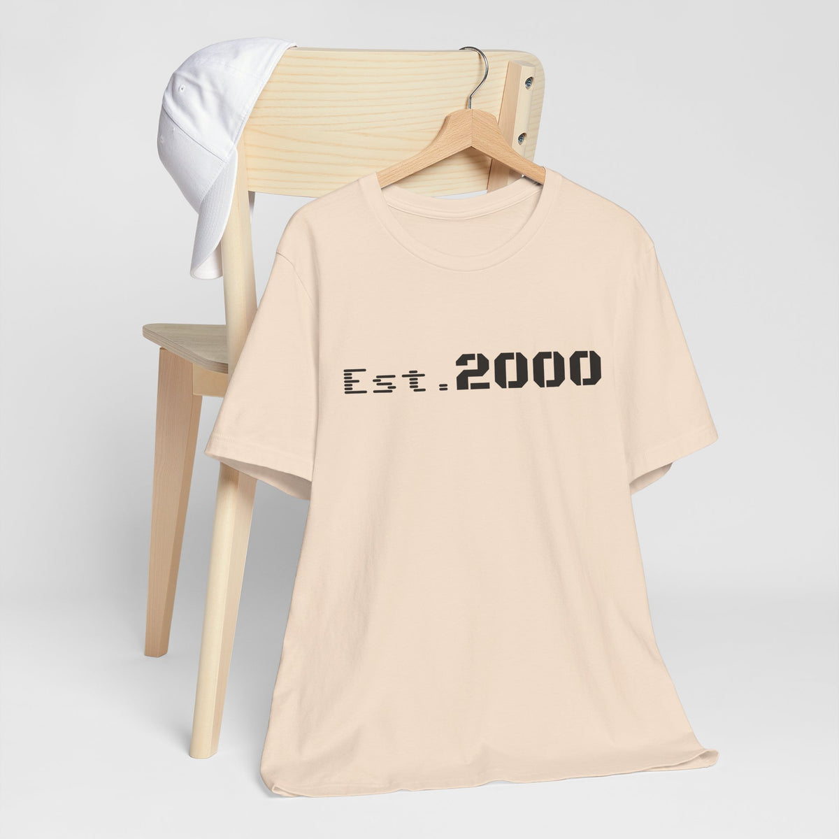Retro pixel design T-shirt celebrating 2000 birth year, printed by Printify with vintage-inspired style.