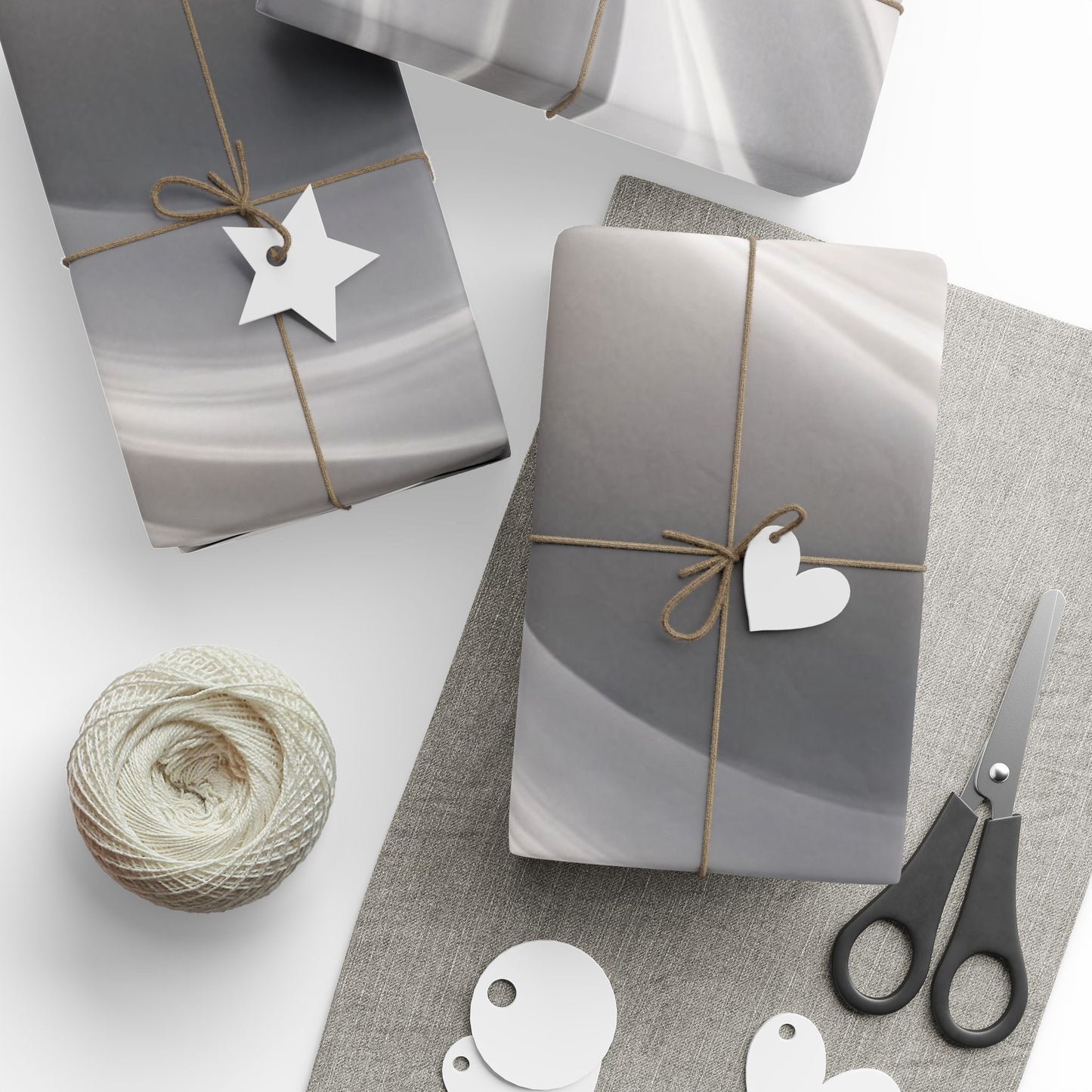 Silver marble swirl wrapping paper with an abstract metallic design, ideal for gift wrapping and decorative packaging.