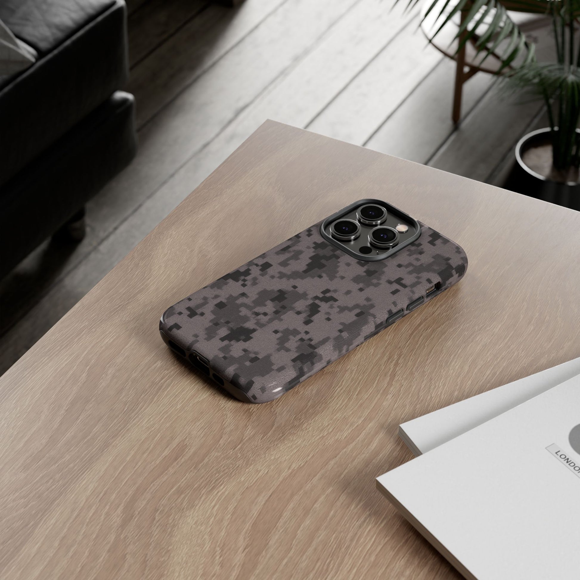 Gray digital camouflage phone case by Printify, tough protective cover for smartphones with a rugged camo design.