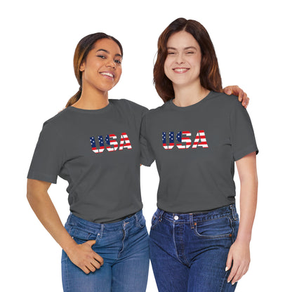 USA flag text T-shirt by Printify, patriotic Fourth of July t-shirt with bold flag design on soft cotton fabric.