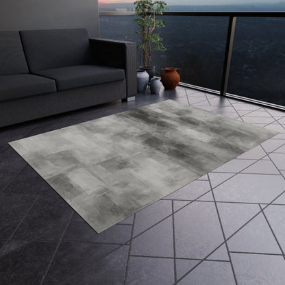 Grey outdoor waterproof rug for patio and deck, designed as a modern blanket-style mat by Printify.