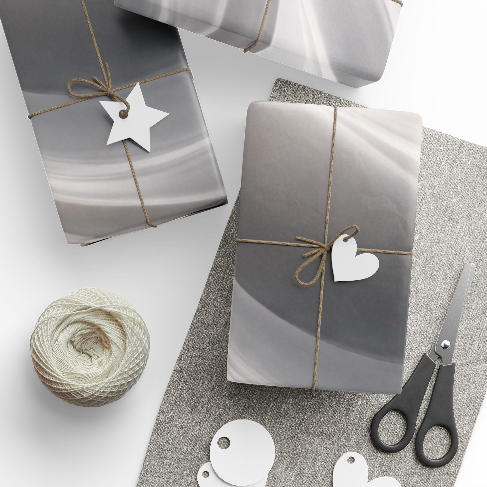 Silver marble swirl wrapping paper with abstract metallic finish, featuring a stylish marble pattern on high-quality gift wrap.