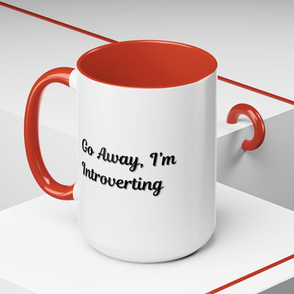 Ceramic mug with "Go Away, I'm Introverting" text, 11 oz, black handle, ideal for coffee or tea, branded by Printify.