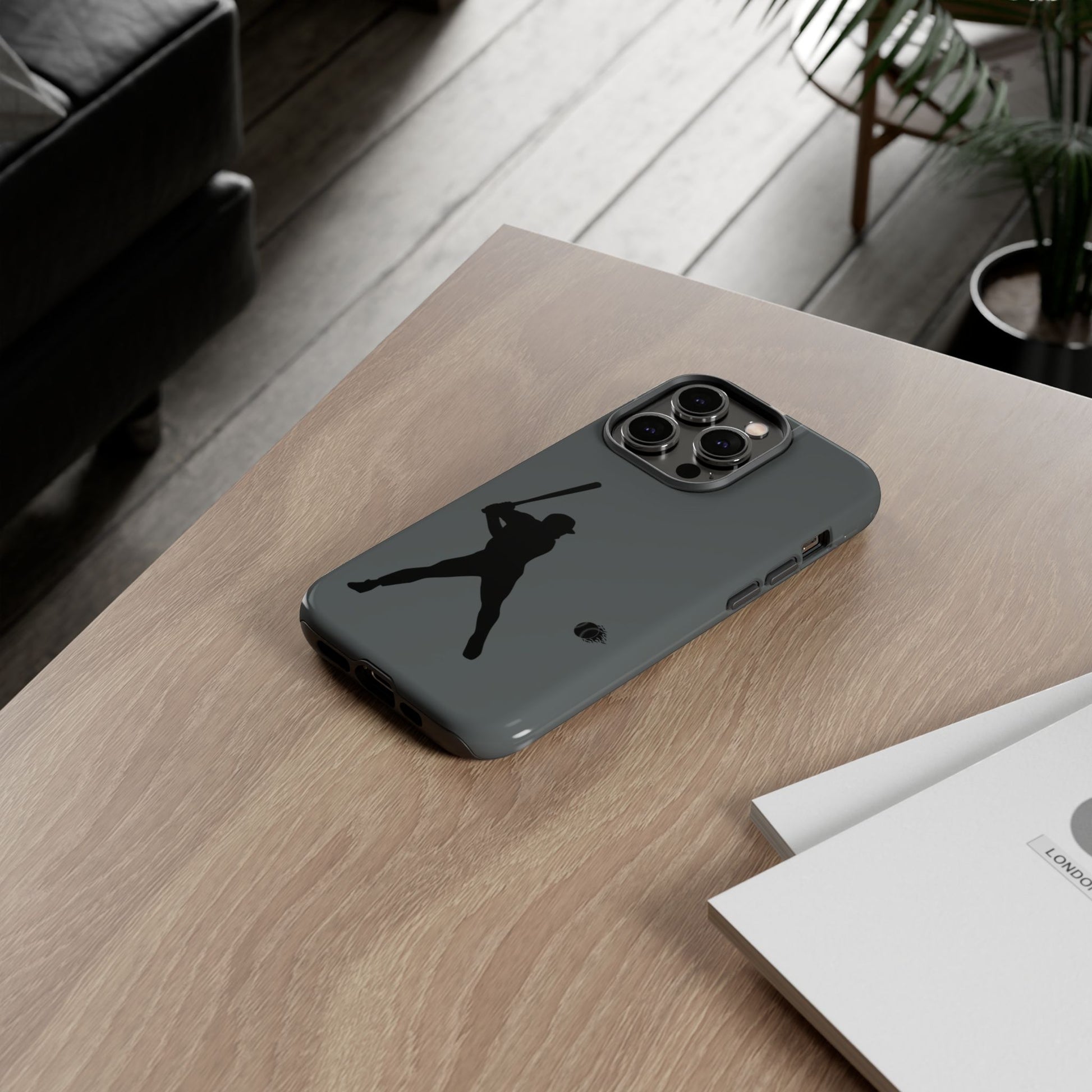 Black iPhone case with white baseball silhouette design, durable protective phone cover for sporty style.