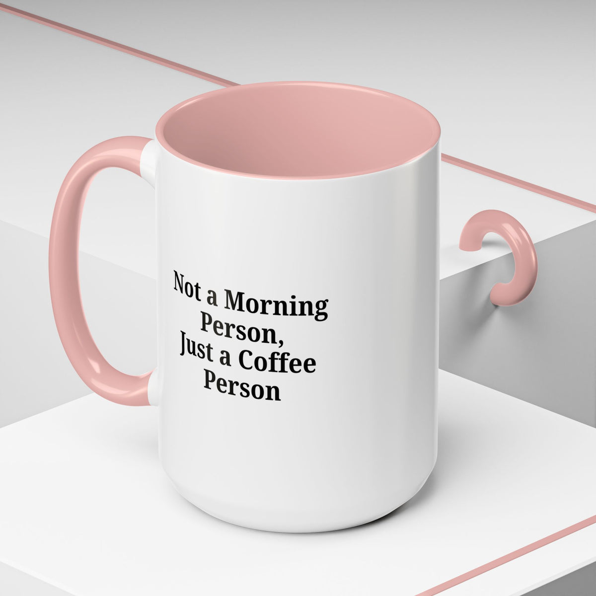 Ceramic coffee mug with the phrase "Not a Morning Person, Just a Coffee Person" printed on it, ideal for coffee lovers.