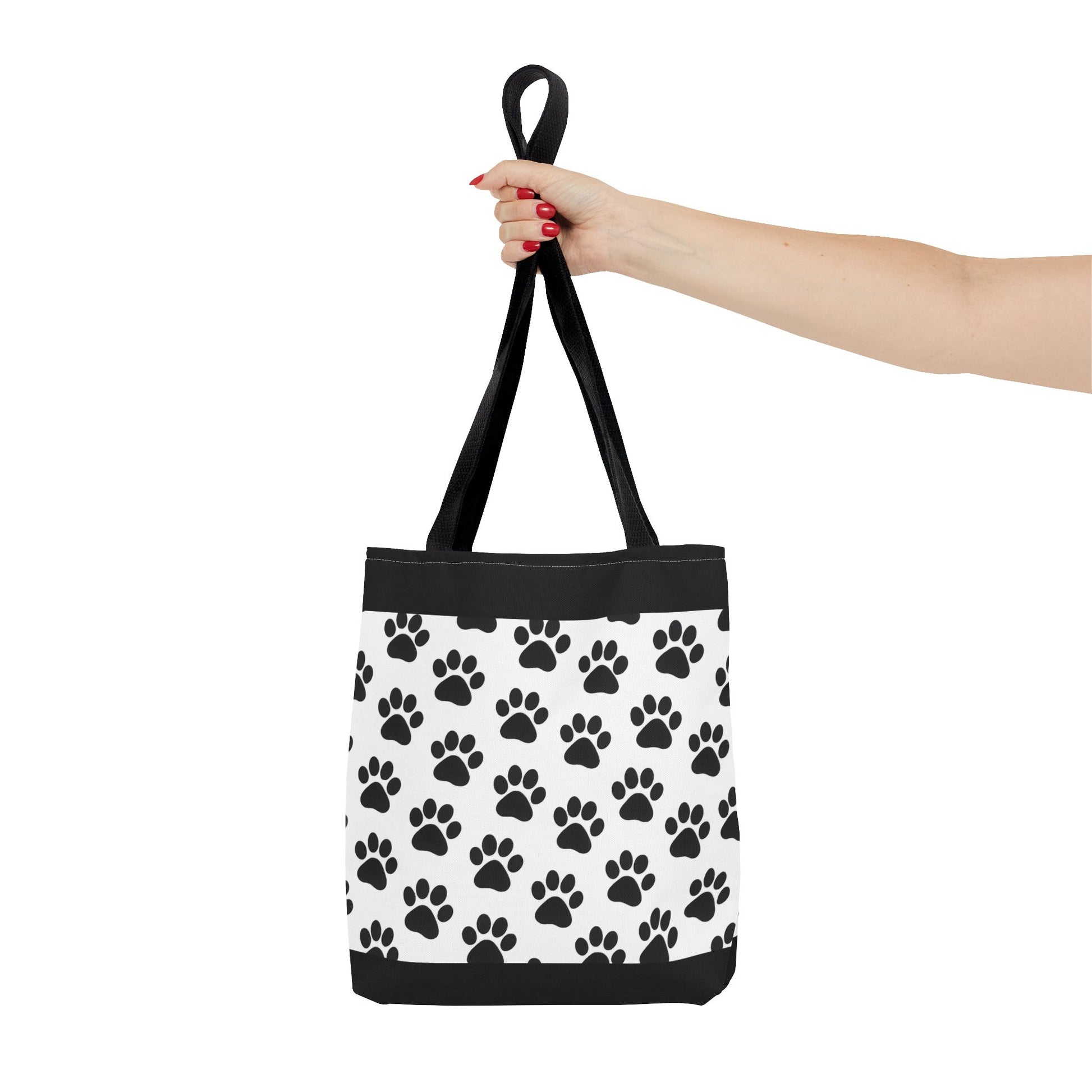 Eco-friendly paw print tote bag by Printify featuring a black and white paw print design, perfect for dog and cat lovers.