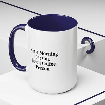 Ceramic coffee mug with "Not a Morning Person, Just a Coffee Person" print, designed for coffee lovers.
