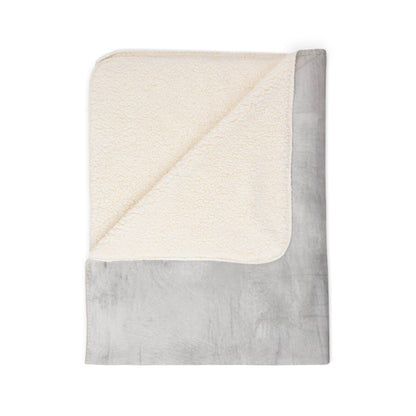 Soft Sherpa fleece throw blanket by Printify, perfect for cozy winter home decor and adding warmth to any space.