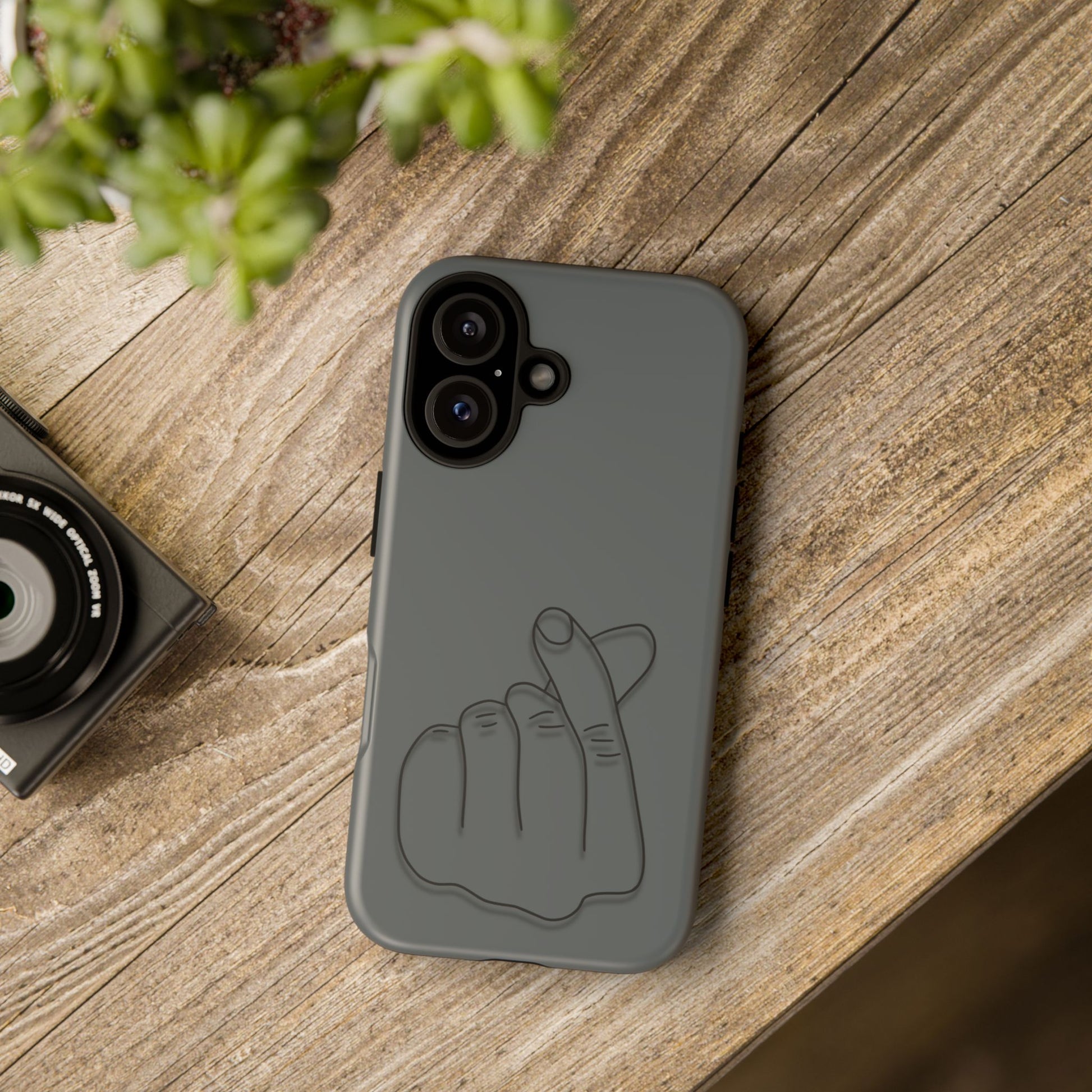 Silicone phone case with embossed Korean finger heart design, compatible with smartphones, by Printify.