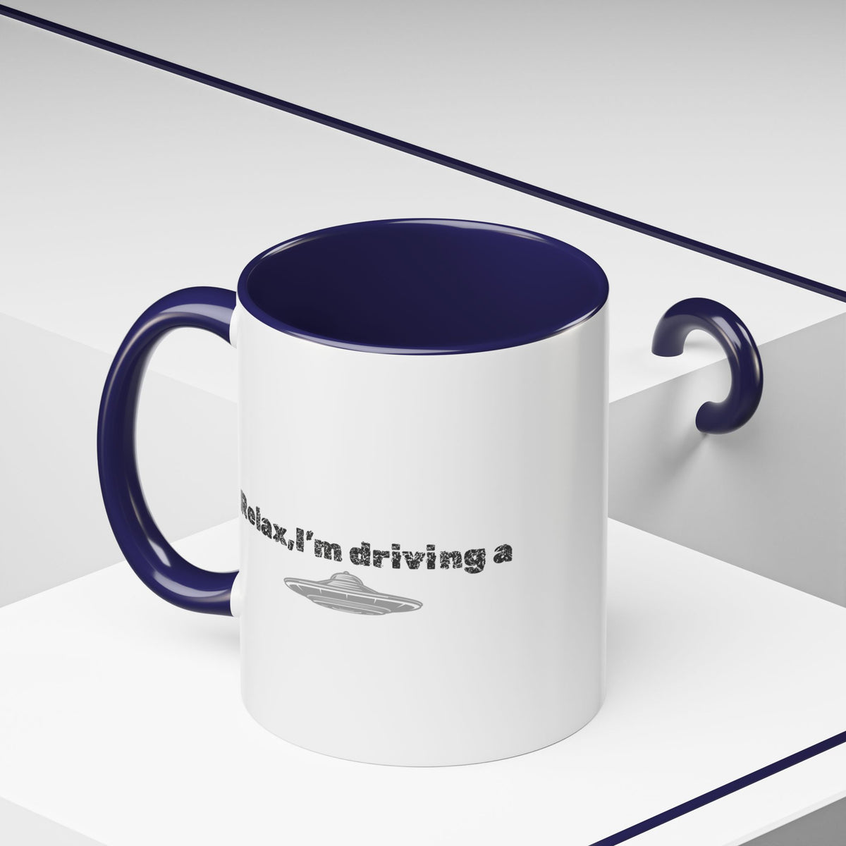 Ceramic coffee mug with "Relax, I’m Driving" UFO design in 11 oz size, featuring colorful alien and spaceship accents.