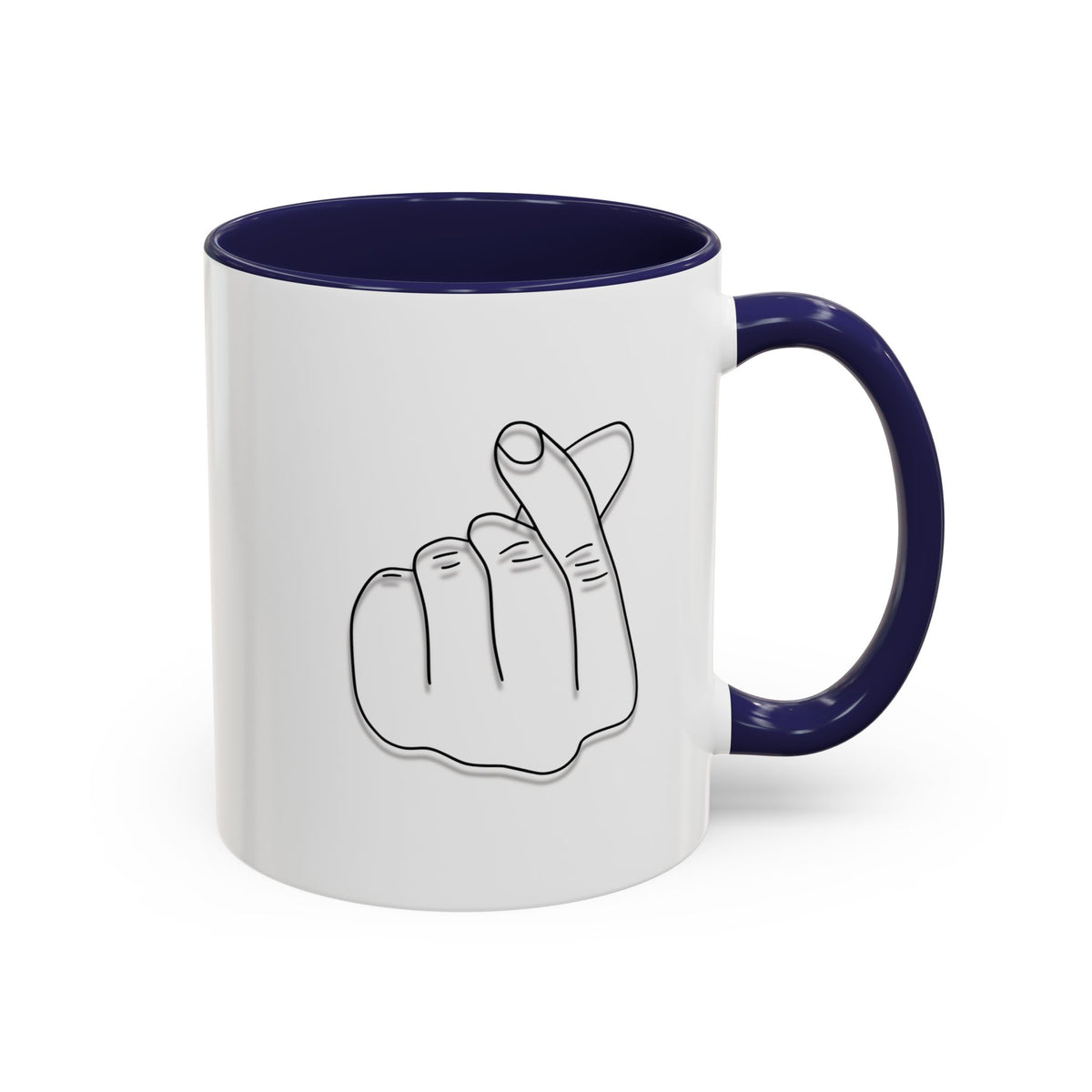 White ceramic coffee mug with minimalist Korean finger heart accent design, available in 11oz and 15oz sizes.