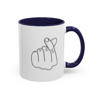 White ceramic coffee mug with minimalist Korean finger heart accent design, available in 11oz and 15oz sizes.