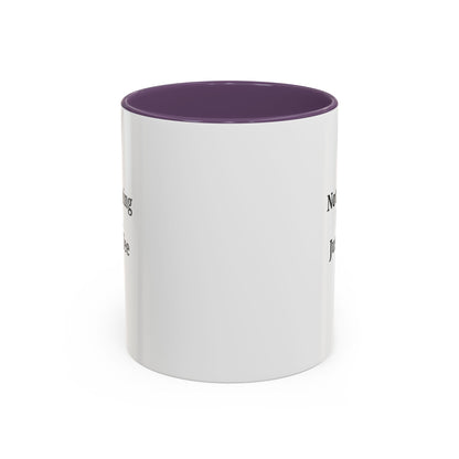 Ceramic coffee mug with "Not a Morning Person, Just a Coffee Person" quote, featuring a white background and colorful lettering.