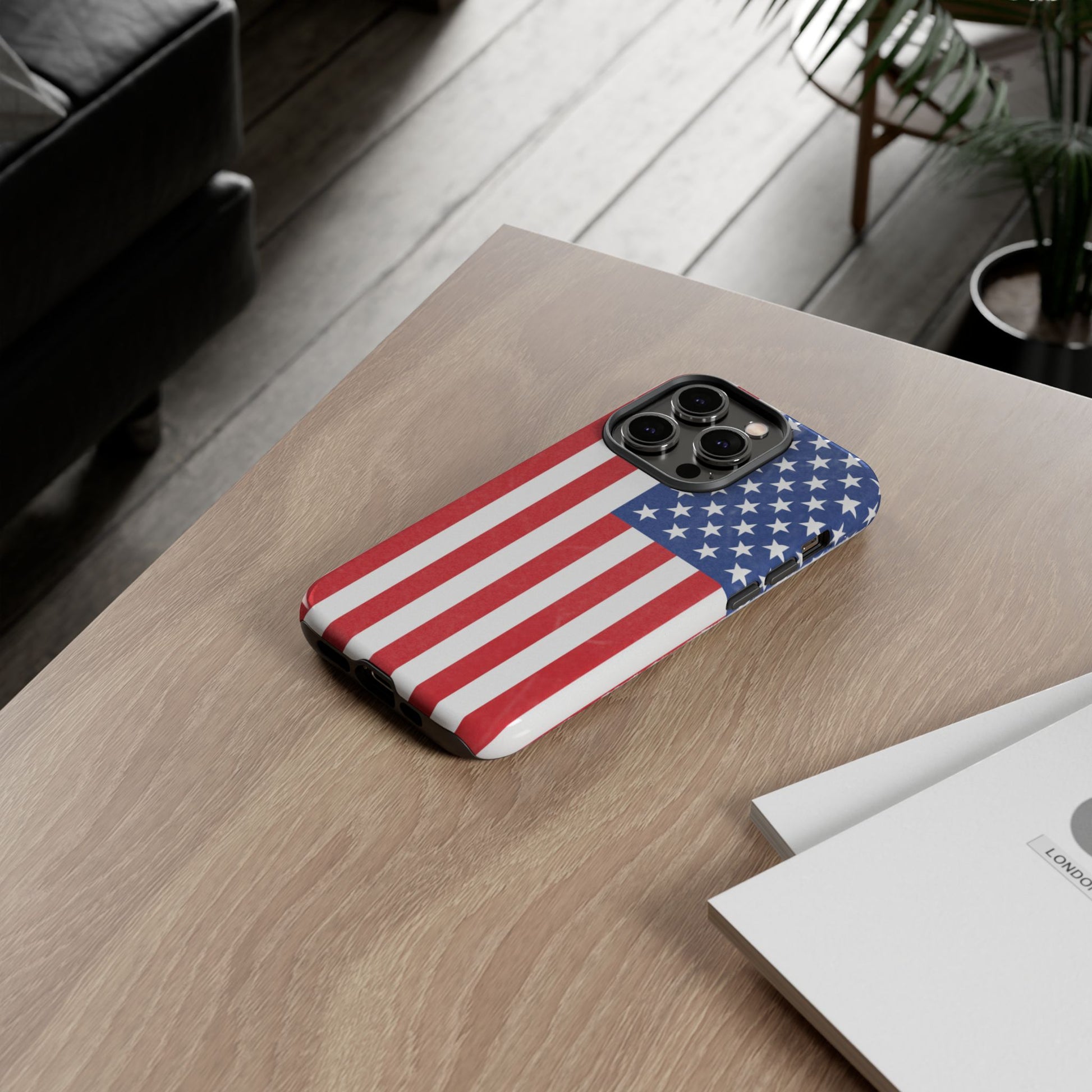 Durable American flag phone case for iPhone with patriotic design, made by Printify, offering protection and style.
