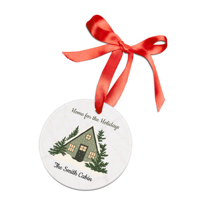 Acrylic "Home for the Holidays" cabin ornament featuring festive holiday design, perfect for Christmas tree decoration.