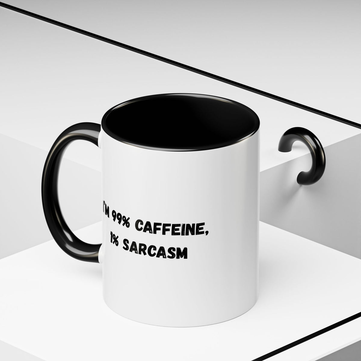 Ceramic coffee mug with "I'm 99% Caffeine, 1% Sarcasm" print, featuring a white background and colorful text design.