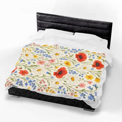 Velvet plush blanket with wildflower meadow and poppy daisy floral print, featuring vibrant all-over floral pattern.
