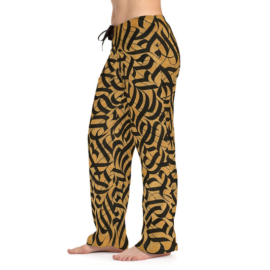 Women's gold and black tribal print pajama pants from Printify with all-over tribal design, cozy lounge sleepwear for women.