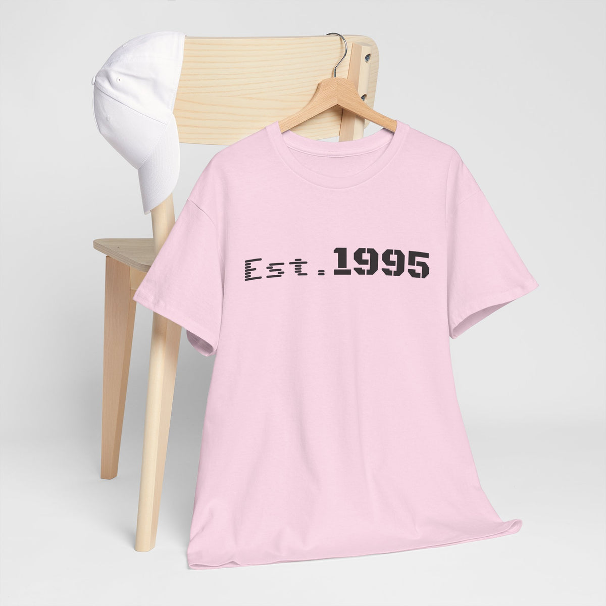 Vintage minimalist "Est. 1995" T-shirt by Printify featuring a stylish birthday design and casual fit.