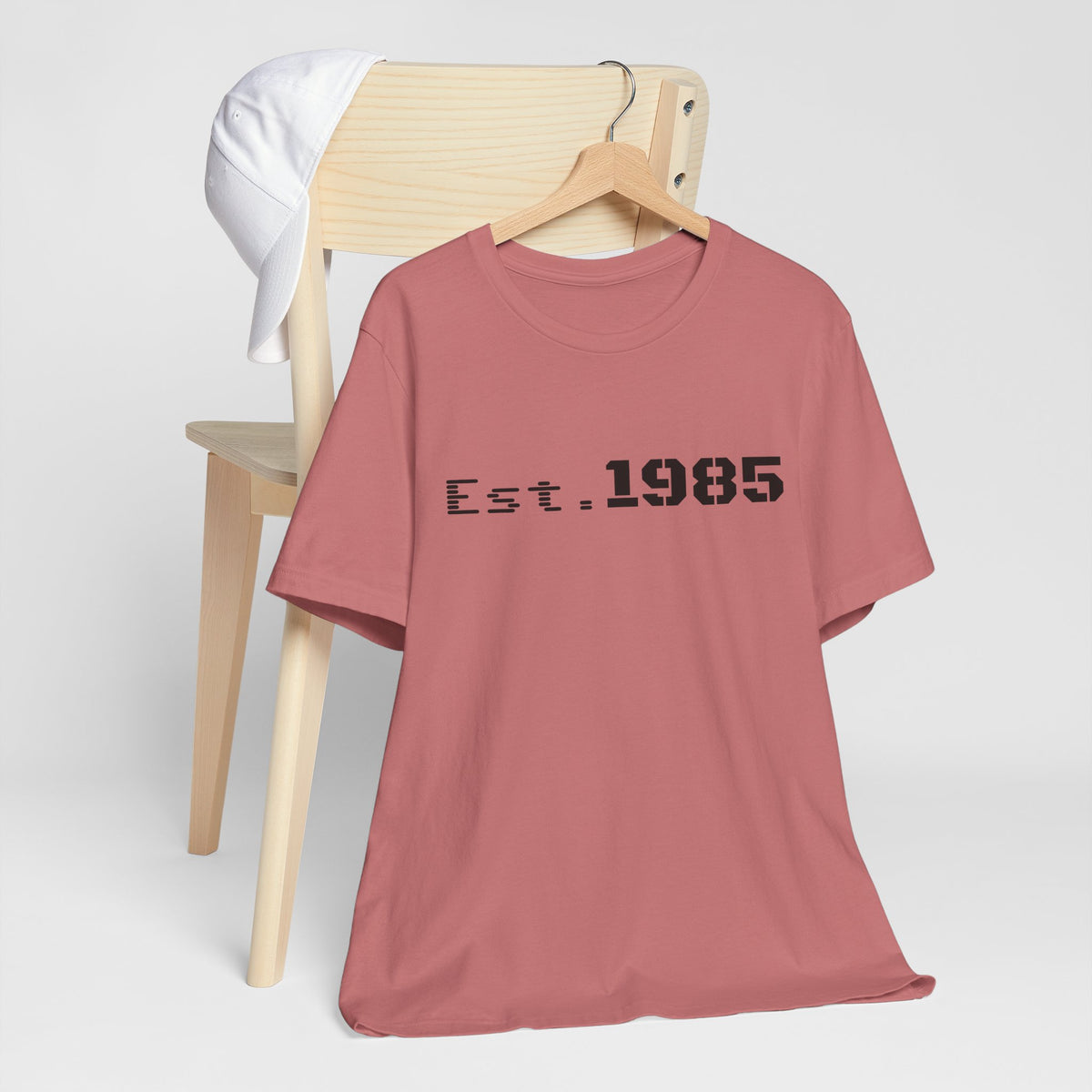 Vintage-style Printify T-shirt featuring "Est. 1985" graphic design, casual unisex T-shirt for retro-inspired fashion.