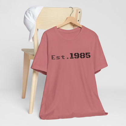 Vintage-style Printify T-shirt featuring "Est. 1985" graphic design, casual unisex T-shirt for retro-inspired fashion.