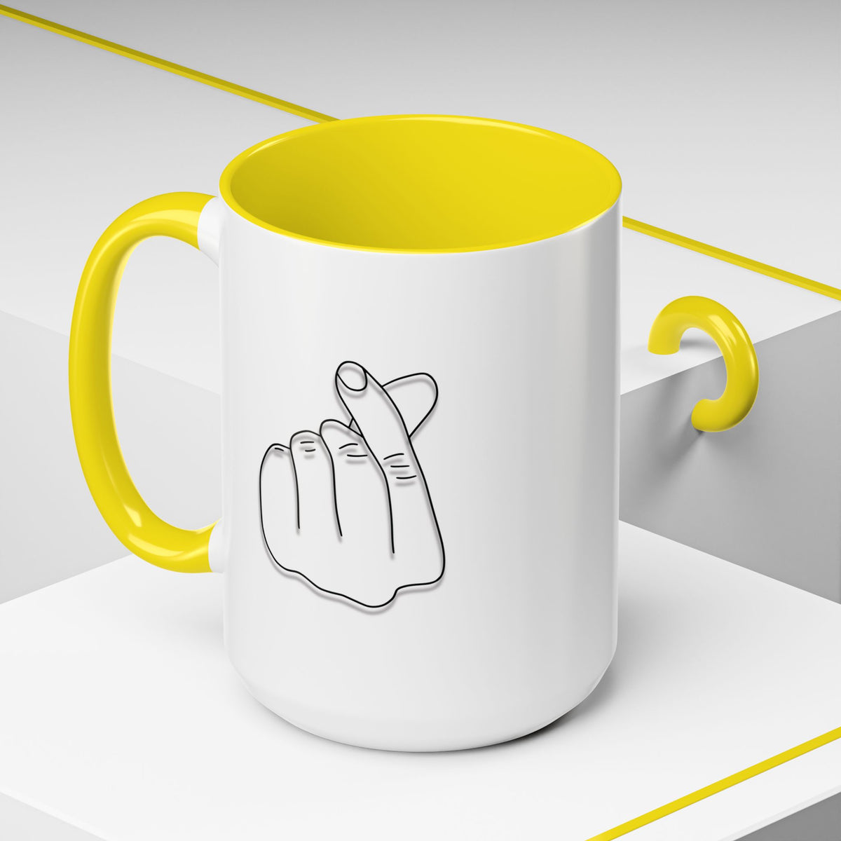 White ceramic coffee mug with minimal Korean finger heart accent design, 11oz or 15oz size, by Printify.