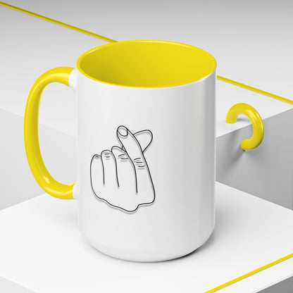 White ceramic coffee mug with minimal Korean finger heart accent design, 11oz or 15oz size, by Printify.