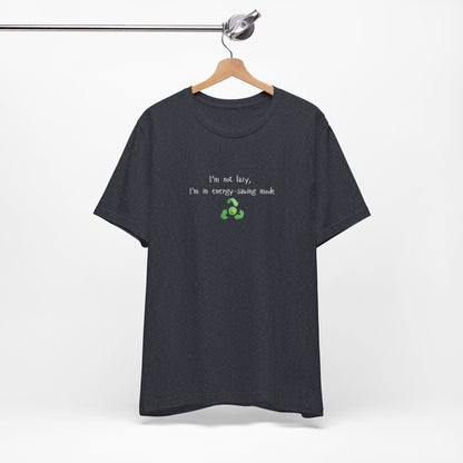 Eco humor T-shirt featuring the phrase "I’m Not Lazy, I’m an Energy-Saving Mock" on a casual printify T-shirt.