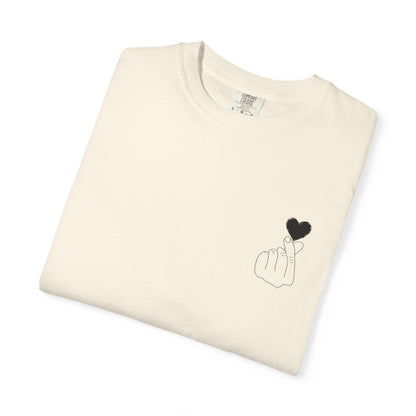 Black T-shirt with a minimal finger heart graphic, featuring a simple black heart design on the front, by Printify.