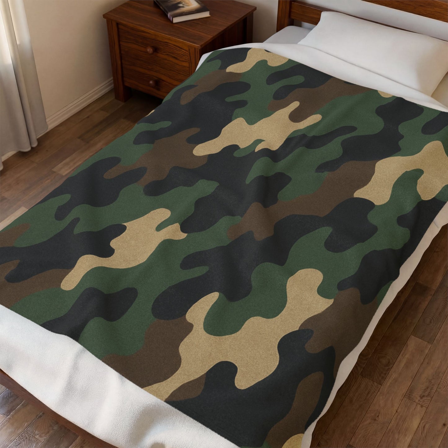 Camouflage velveteen plush blanket with all-over print, soft camo throw for camping, hunting, or cozy home use.