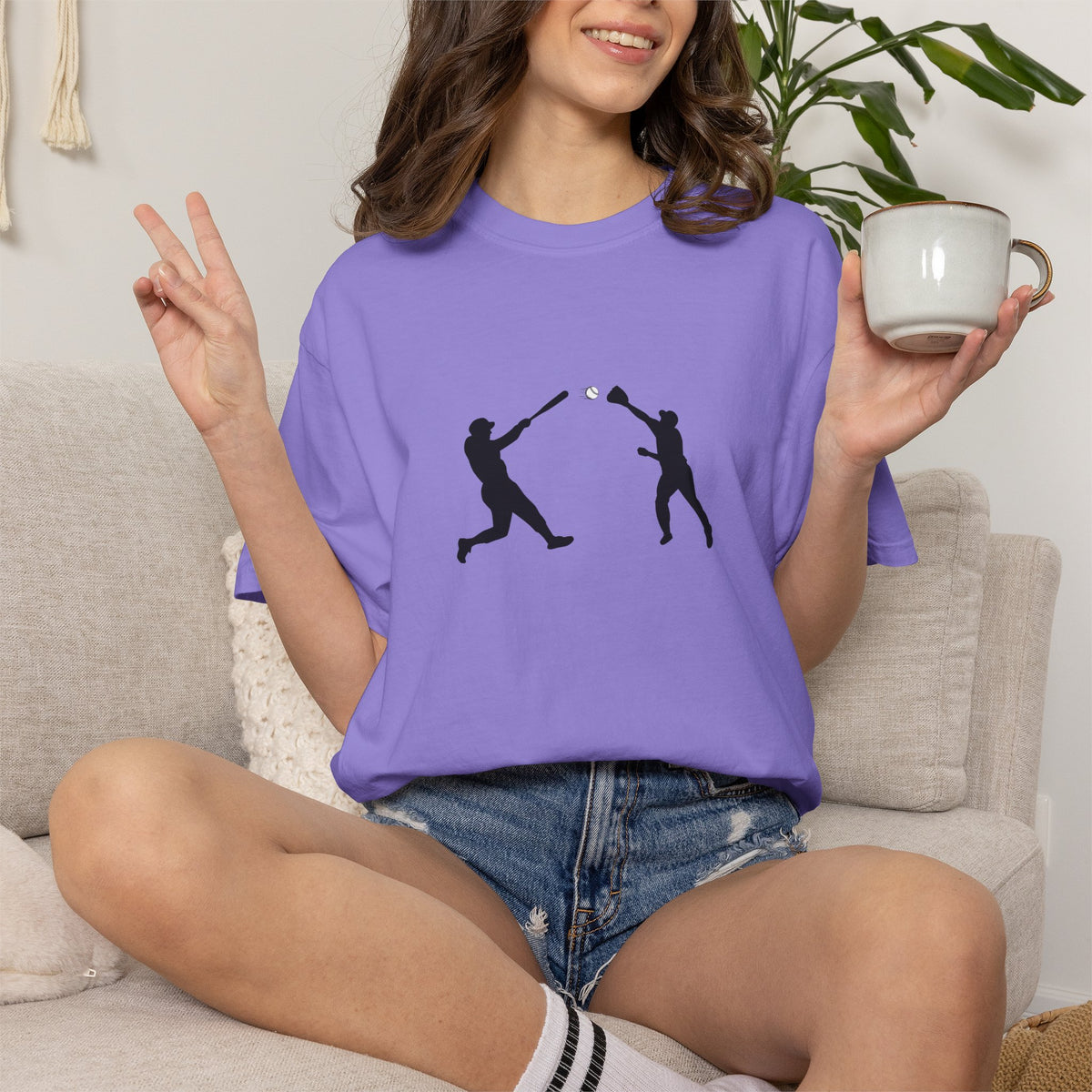 Minimalist baseball player silhouette T-shirt by Printify featuring a simple graphic design on a casual tee.