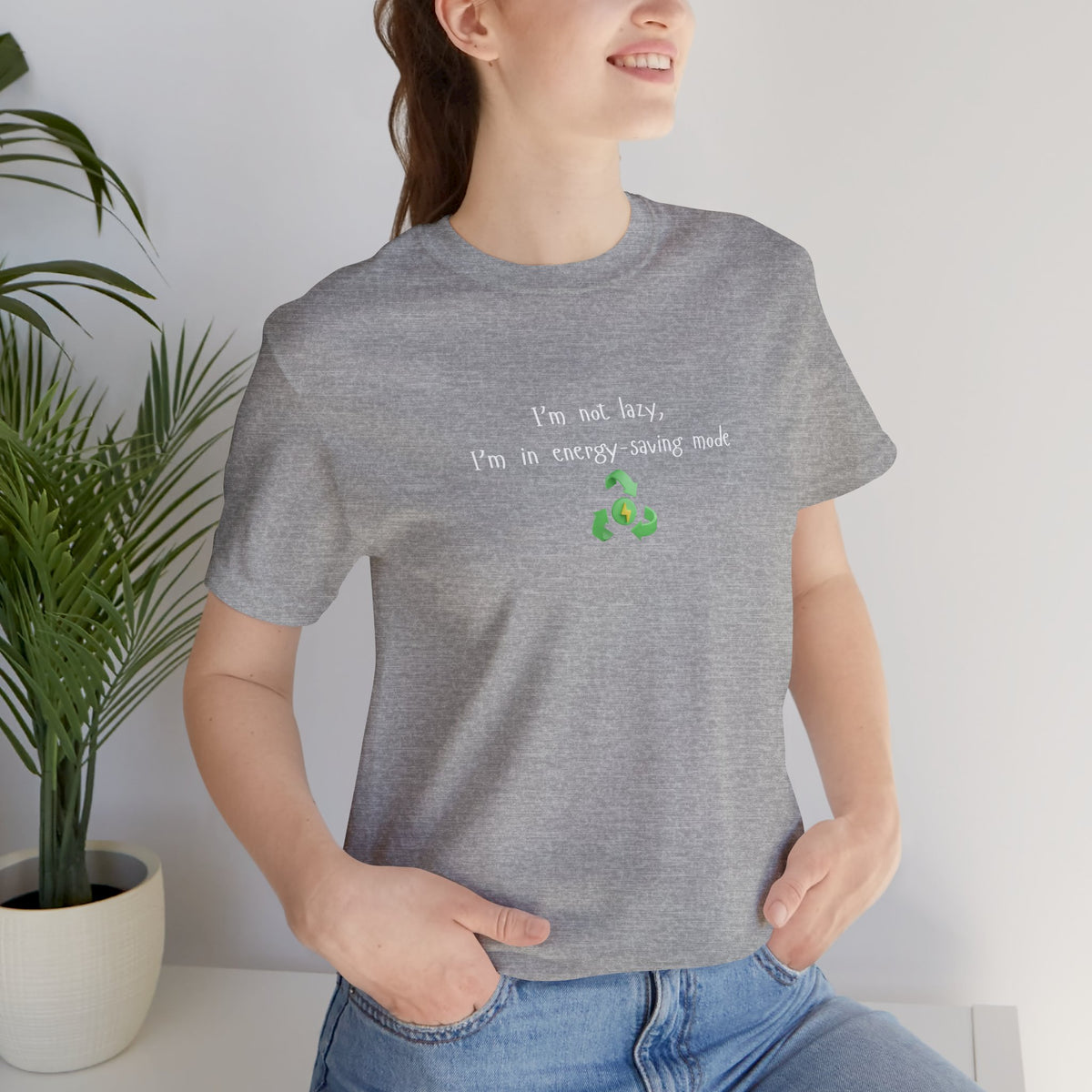 Eco humor T-shirt featuring the phrase "I’m Not Lazy, I’m an Energy-Saving Mock" by Printify, casual unisex tee in soft fabric.