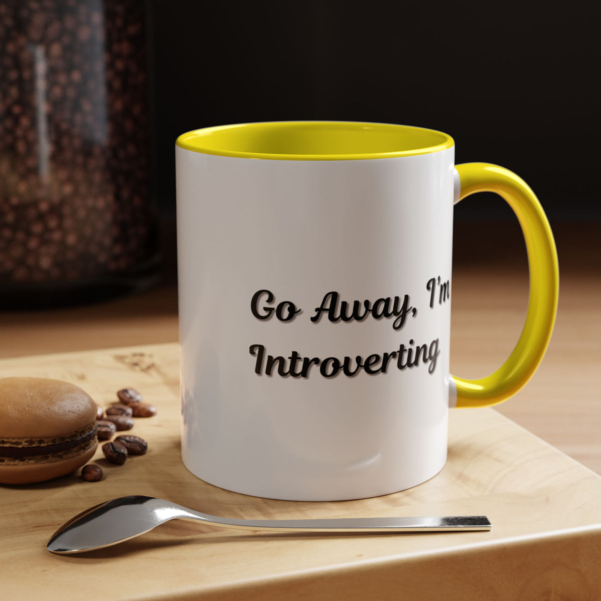 Ceramic introvert coffee mug with "Go Away, I'm Introverting" quote, 11 oz capacity, featuring a white background and black text.