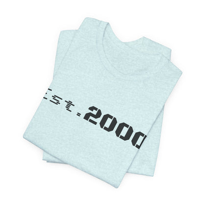 Retro pixel style T-shirt with "Born in 2000" text, printed on a Printify branded T-shirt, celebrating the year 2000.