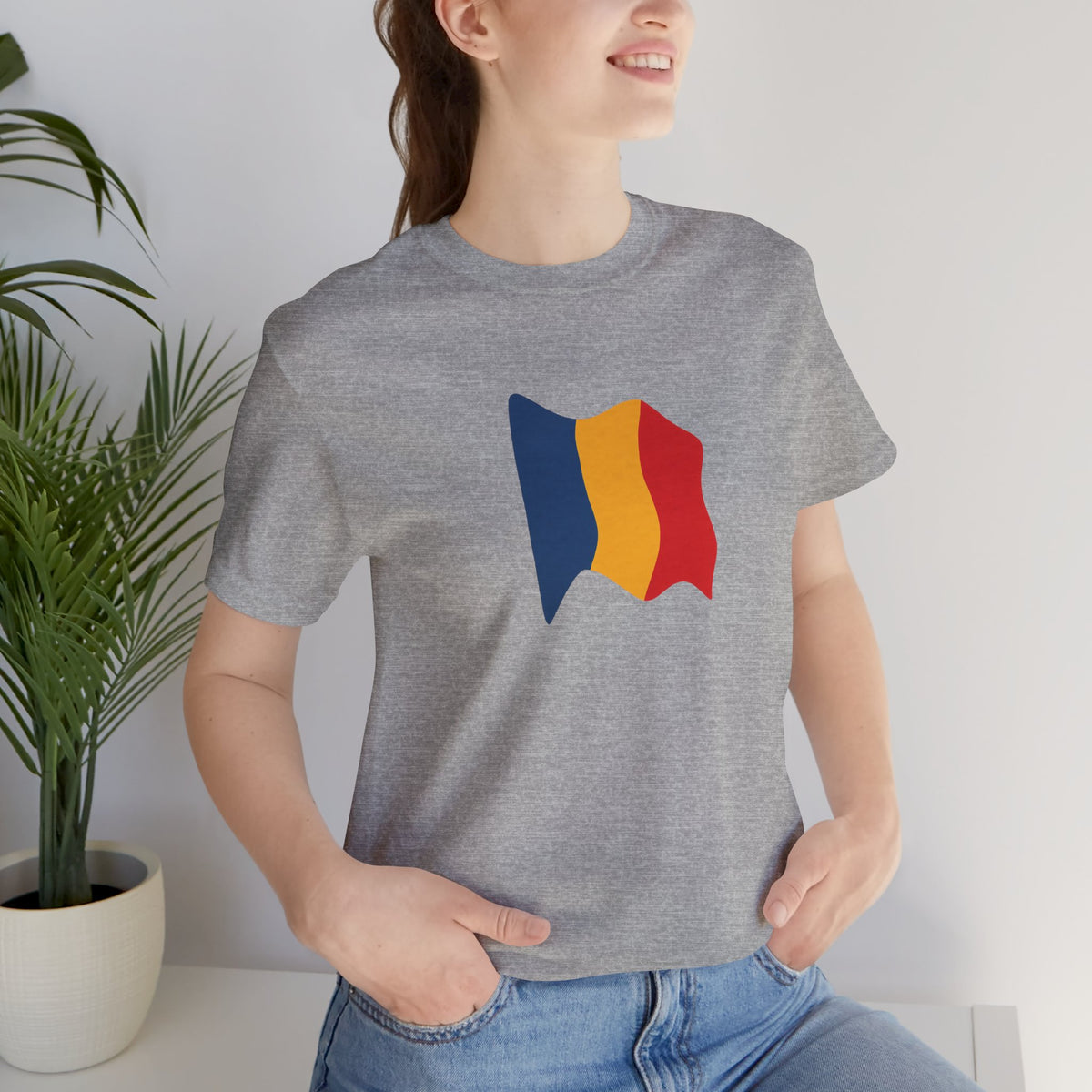 Romania flag T-shirt by Printify featuring a minimal waving tricolor design on a casual cotton tee.