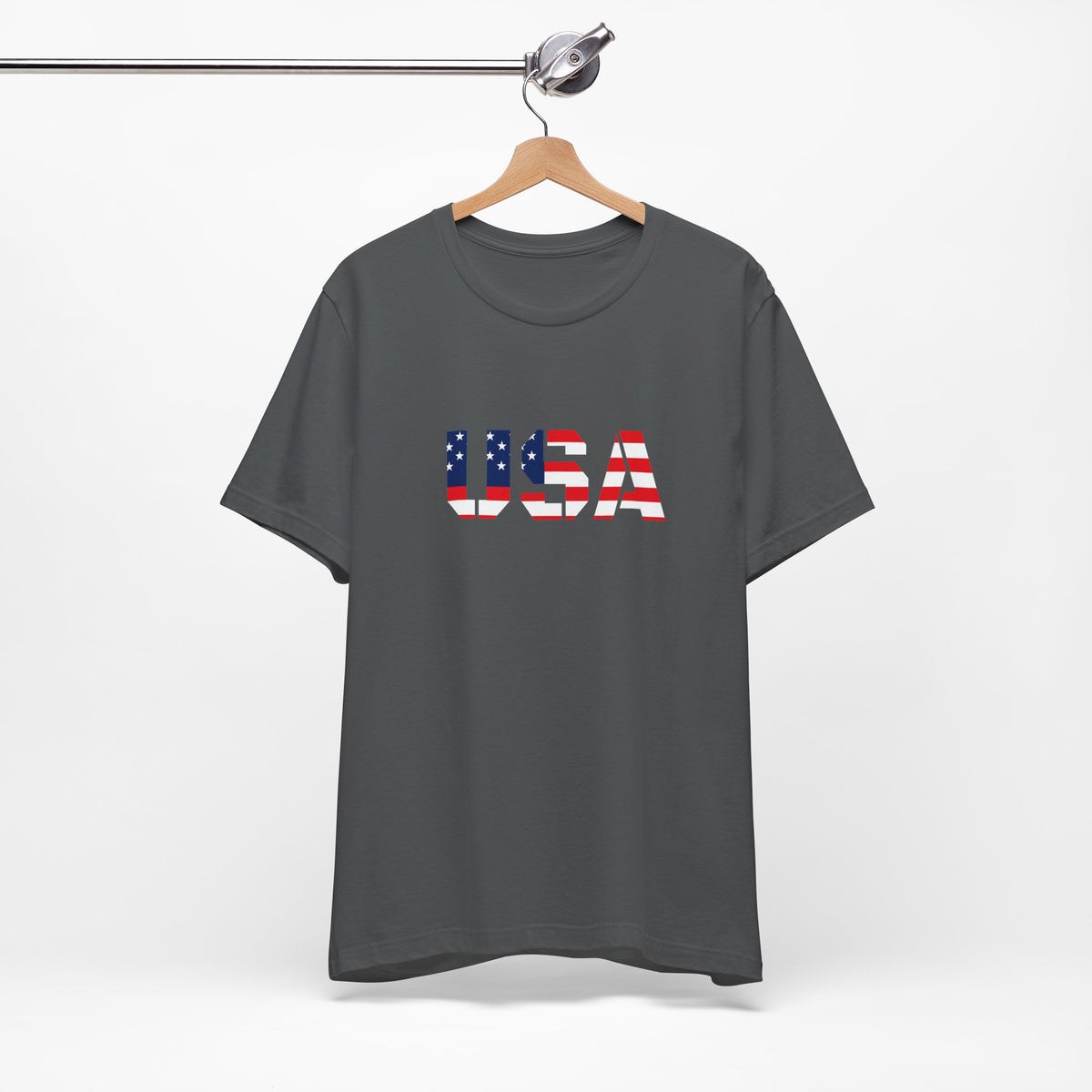USA Flag Text T-Shirt by Printify featuring patriotic red, white, and blue design for Fourth of July celebrations.