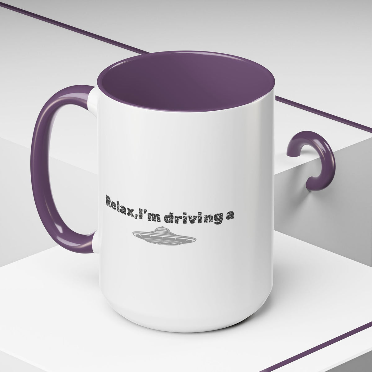 Ceramic coffee mug with "Relax, I’m Driving" UFO accent design, available in 11 or 15 oz, by Printify.