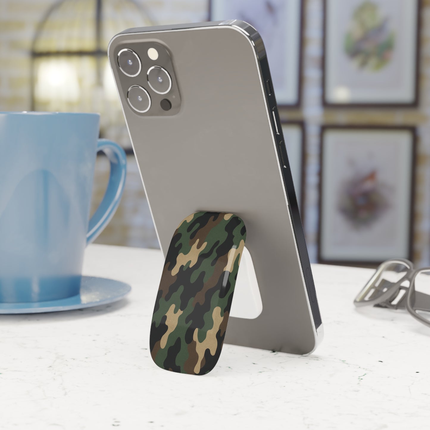 Military green camo phone grip with click-on stand and secure hold, designed for easy handling and versatile device support.