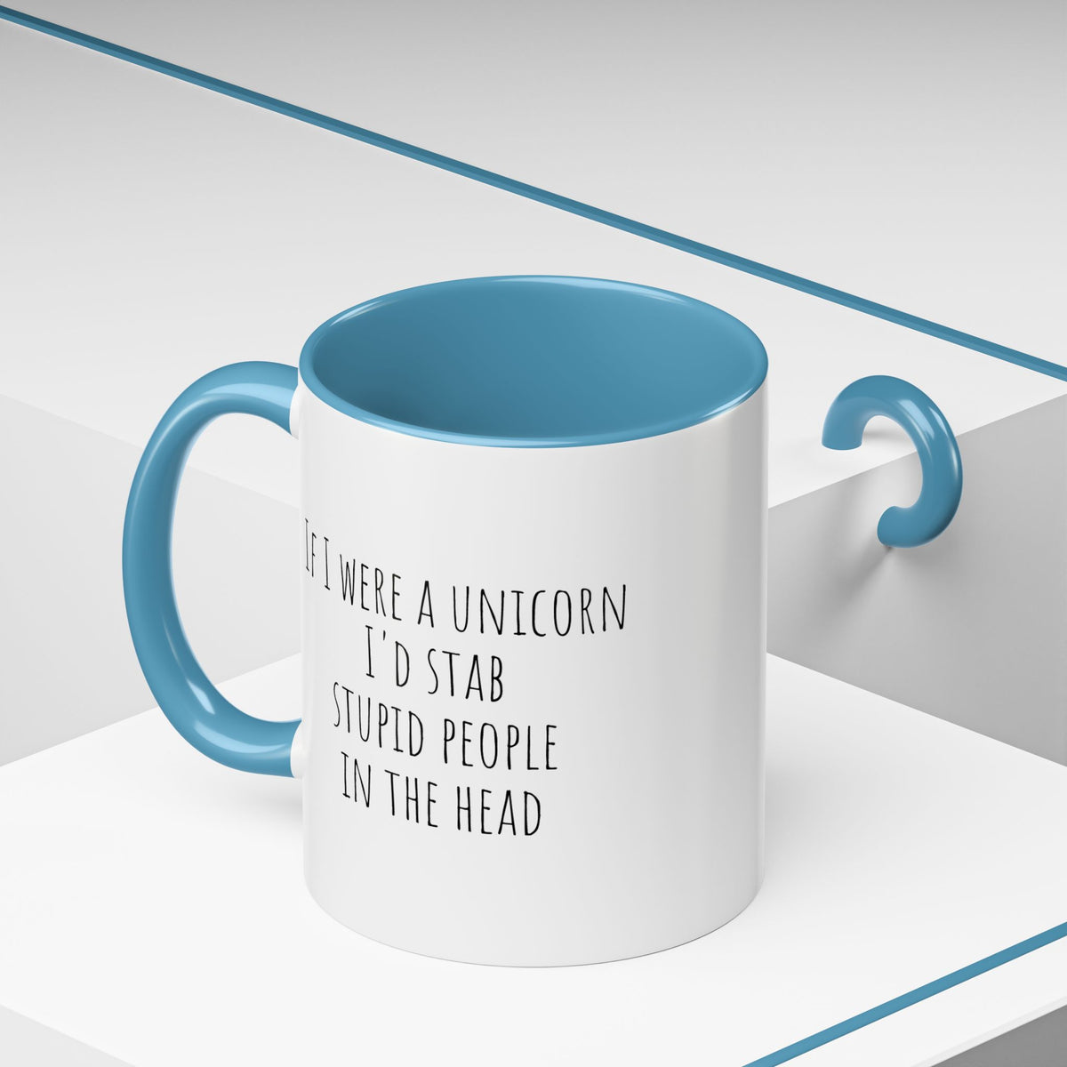 Funny unicorn mug with humorous text "If I Were A Unicorn ... Stab Stupid People In The Head" printed on ceramic surface.