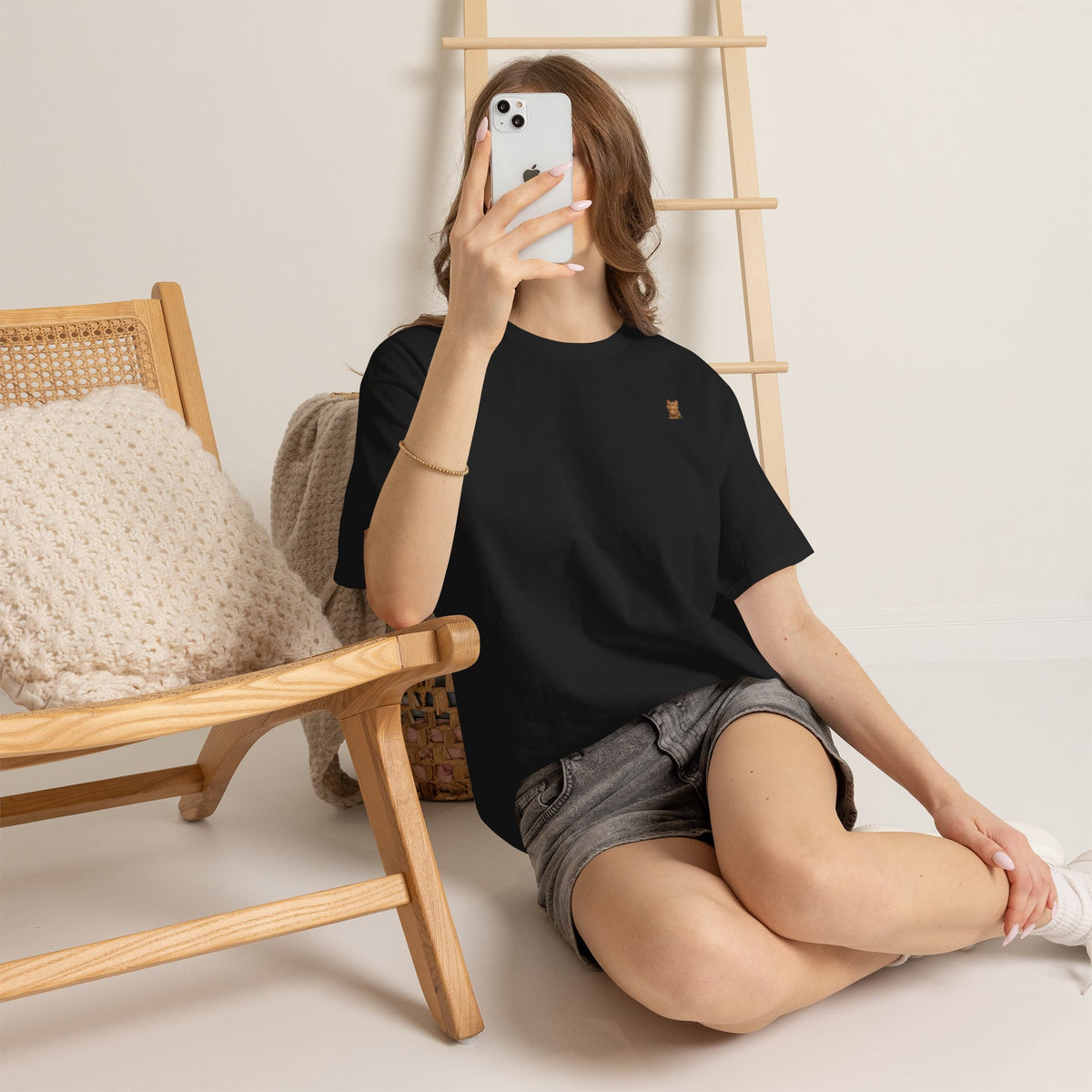 Cute brown kitten graphic T-shirt for cat lovers, featuring a playful feline design on a casual tee by Printify.